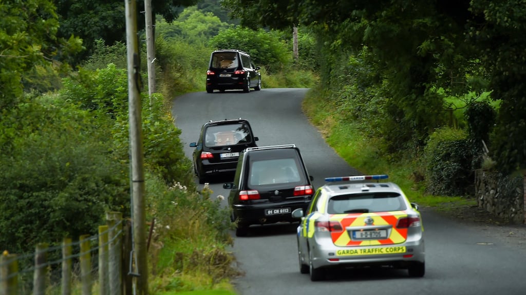 Hearses leaves the scene at Oakdene, Barconey, Ballyjamesduff in Cavan, where a family of five were found dead in their countryside home on Monday Photograph: Philip Fitzpatrick/PA