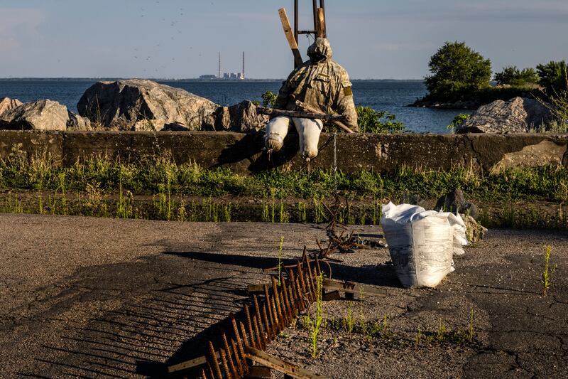 A decoy soldier sits in Ukrainian-held territory near Nikopol, across the Dnieper River from the Zaporizhzhia nuclear power plant. Photograph: David Guttenfelder/The New York Times