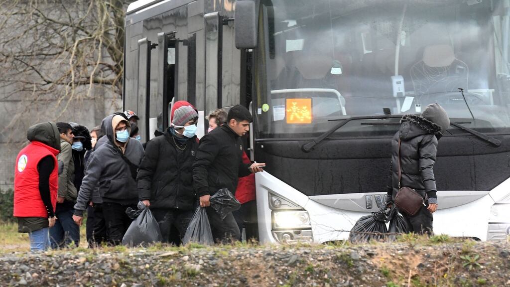 Migrants who were found soaked after a failed attempt to cross the Channel take a bus in Calais on Thursday. Photograph: Francois Lo Presti/AFP via Getty Images
