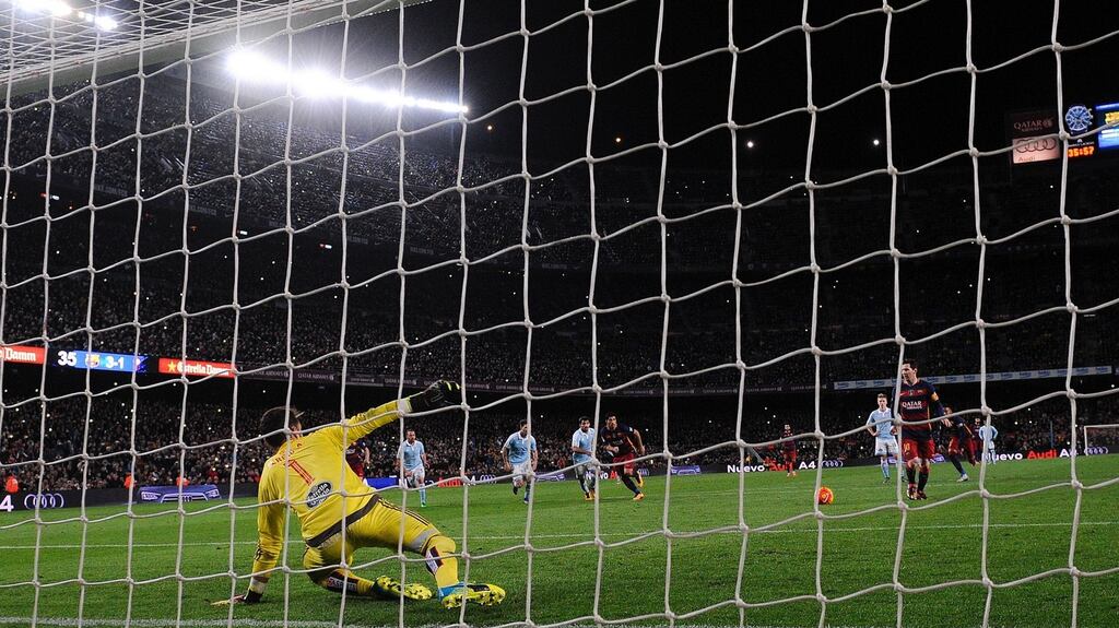 Barcelona’s Lionel Messi lays the ball off to Luis Suarez to complete his hat-trick in their side’s La Liga clash with Celta Vigo at the Nou Camp. Photo: Reuters