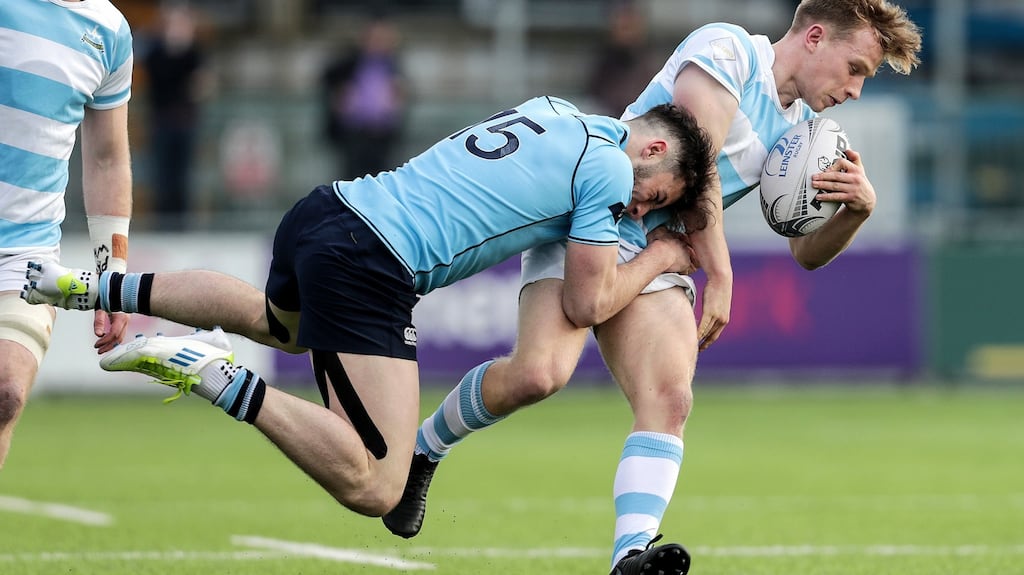 Blackrock College’s Ben White is tackled by Andrew Smith of St. Michael’s College. Photograph: Laszlo Geczo/Inpho
