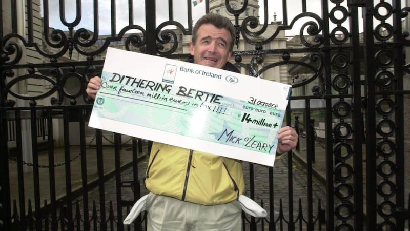 Ryanair: Michael O’Leary outside Government Buildings in October 2003 before handing in a cheque for €14 million – his estimate of his taxes – to Bertie Ahern while criticising the government for the lack of competing terminals at Dublin Airport. Photograph: Alan Betson