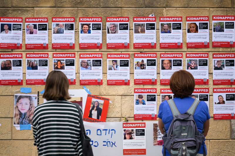 Photographs in Tel Aviv of some of the people taken hostage by Hamas. Photograph: Leon Neal/Getty Images