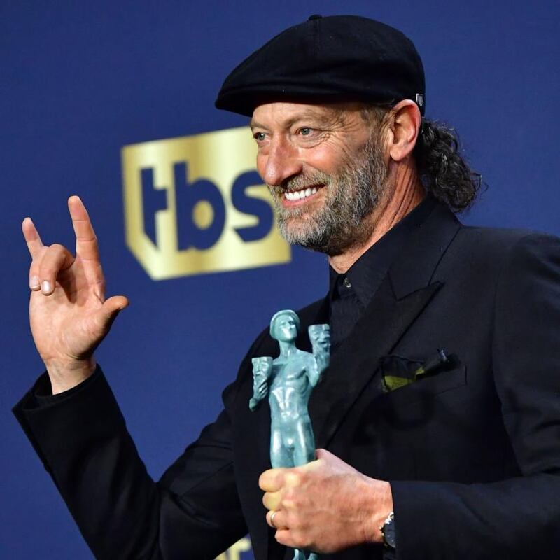 US actor Troy Kotsur poses with his award for Outstanding Performance by a Male Actor in a Supporting Role for his performance in Coda. Photograph: Frederic J Brown/AFP via Getty Images