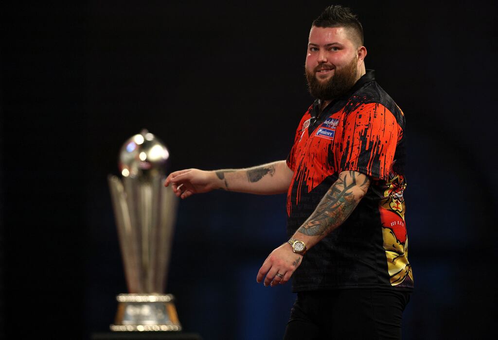 England's Michael Smith reacts during the PDC World Darts Championship final match against Netherlands' Michael van Gerwen. Photograph: Adrian Dennis/AFP via Getty