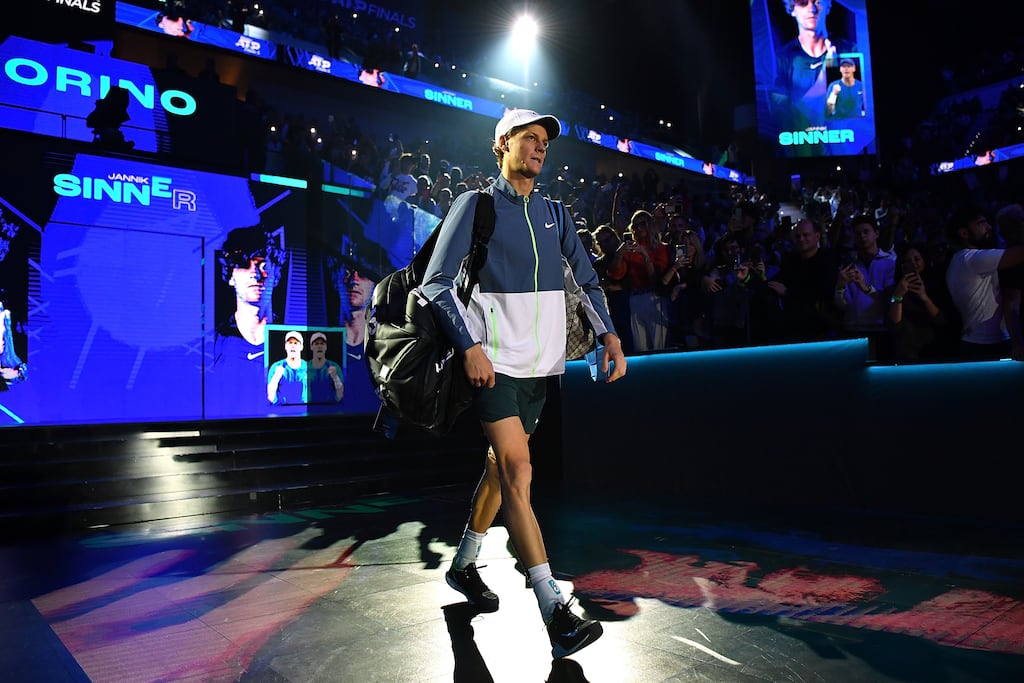 Jannik Sinner of Italy walks out to the court for his match against Novak Djokovic of Serbia in the Men's Singles Round Robin match on day three of the Nitto ATP Finals at Pala Alpitour on November 14, 2023 in Turin, Italy. (Photo by Valerio Pennicino/Getty Images)