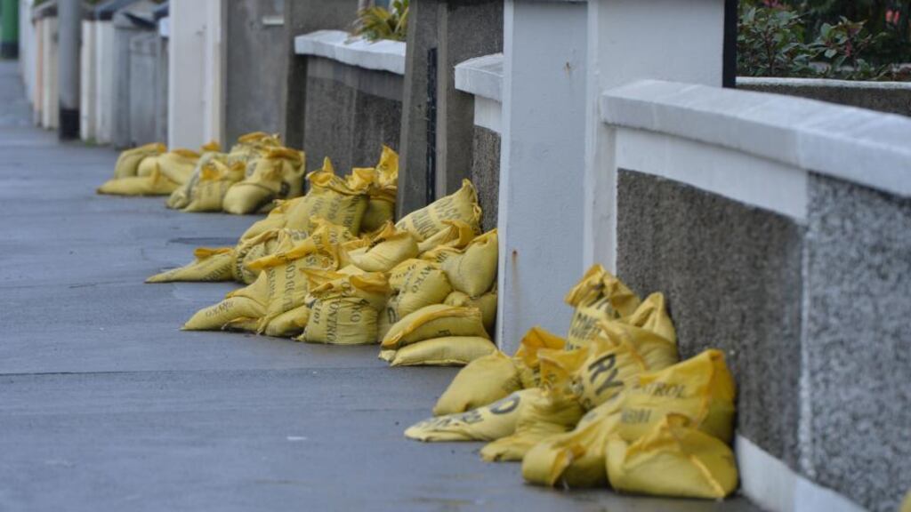 Anti-flood barrier measures in place in front of coastal houses ahead of high tiddes. Photograph: Alan Betson