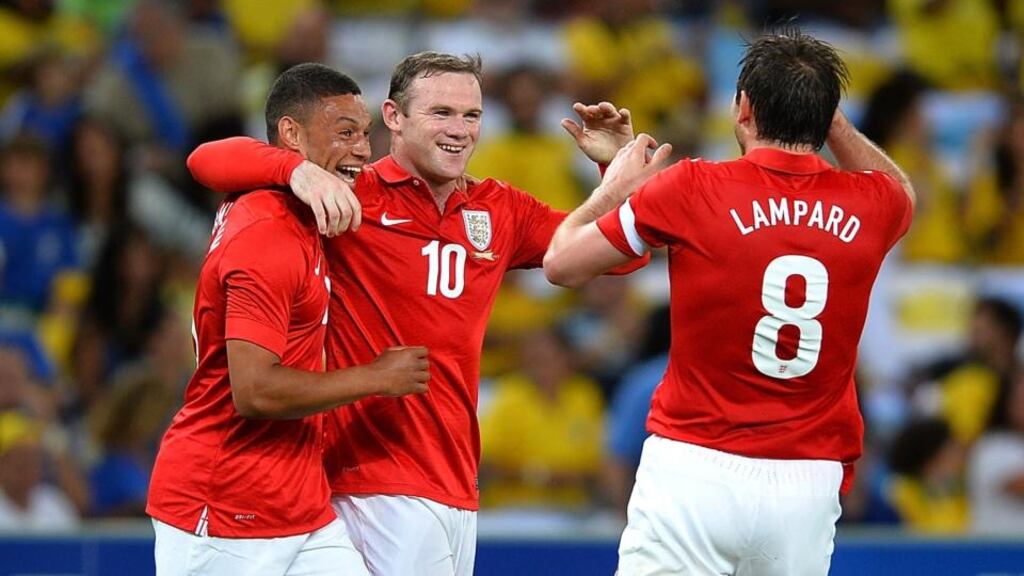 Wayne Rooney celebrates scoring England’s second goal with Alex Oxlade-Chamberlain and Frank Lampard at the Maracana last night. Photograph: Laurence Griffiths/Getty Images