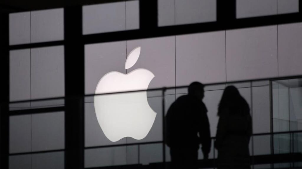 People walk past the Apple logo near an Apple Store at a shopping area in central Beijing. Photograph: Petar Kujundzic/Reuters