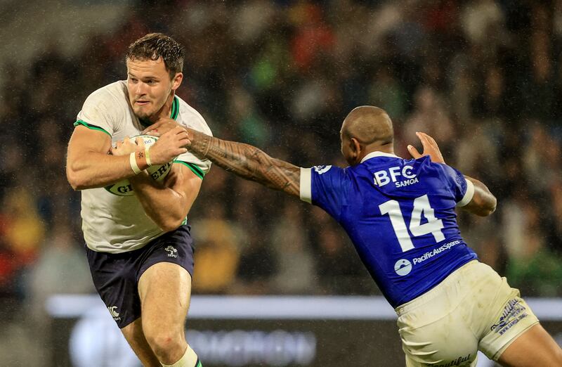 Ireland’s Jacob Stockdale with Ed Fidow of Samoa. Photograph: Dan Sheridan/Inpho