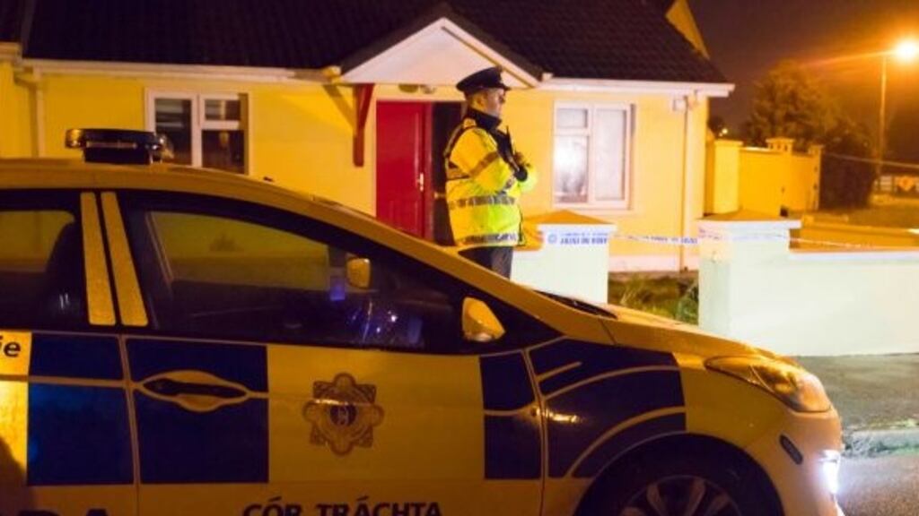 A garda stands watch at the house where a man died at Coolfin Meadows, Portlaw, Co Waterford. Photograph: Patrick Browne