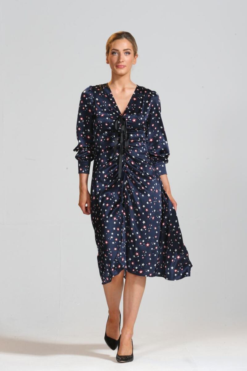 Star print silk satin dress with bow and ruched detail (€395), Niamh O’Neill