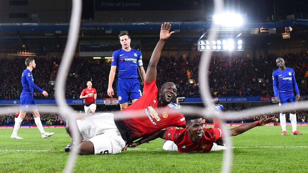 Paul Pogba of Manchester United celebrates with Romelu Lukaku after scoring his team’s second goal during the FA Cup fifth round win over Chelsea at Stamford Bridge. Photo: Michael Regan/Getty Images