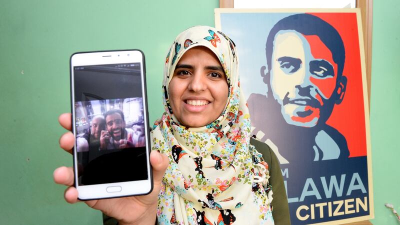Ibrahim Halawa’s sister Fatima shows a picture of her brother after his release last night. Photograph: Cyril Byrne/The Irish Times