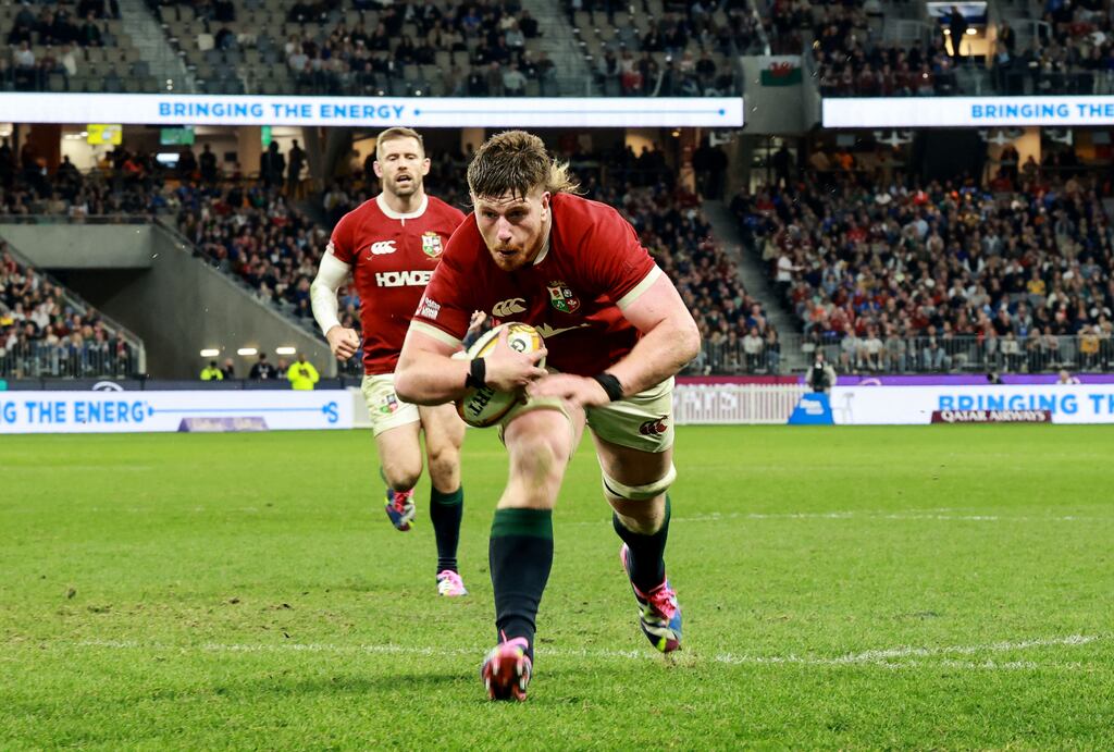 Lions' Joe McCarthy runs in to score a try. Photograph: Dan Sheridan/Inpho