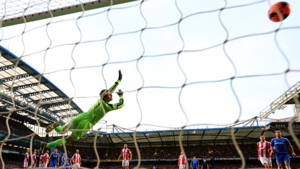 Stoke City goalkeeper Asmir Begovic fails to get a touch to Oscar’s match-winning free-kick during the FA Cup fourth-round tie at Stamford Bridge. Photograph:   Ian Walton/Getty Images