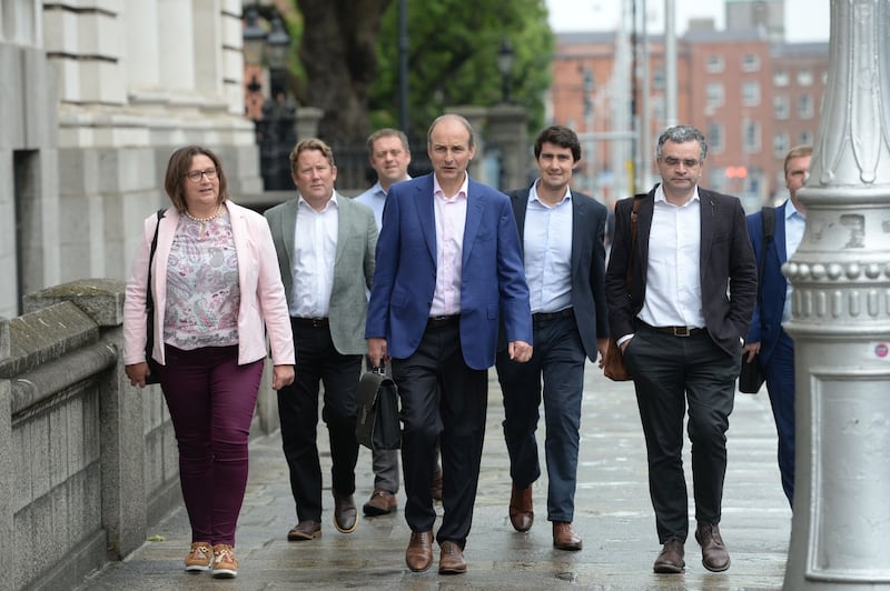 Fianna Fáil’s government-formation negotiators arrived tieless at Government Buildings. Photograph: Alan Betson