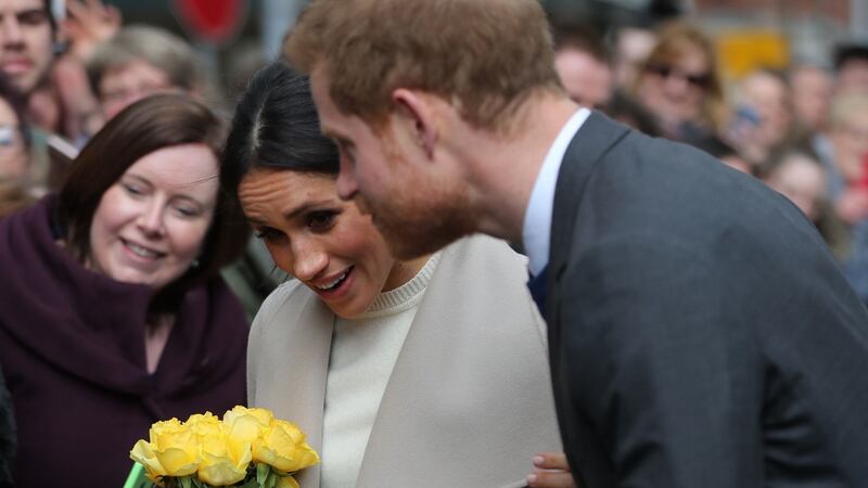 Meghan Markle and Prince Harry meet members of the public after visiting the  Crown Bar in Belfast. Photograph:  Gareth Fuller/Pool/Getty Images.
