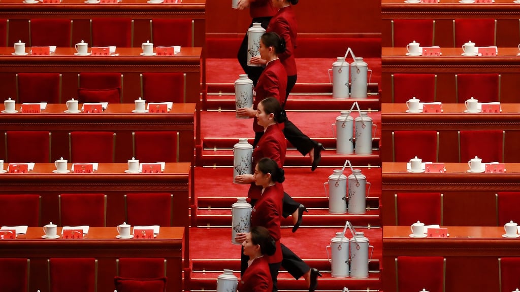 Stewardesses prepare tea flasks for delegates before the opening ceremony of the Communist Party congress. Photograph: How Hwee Young/EPA