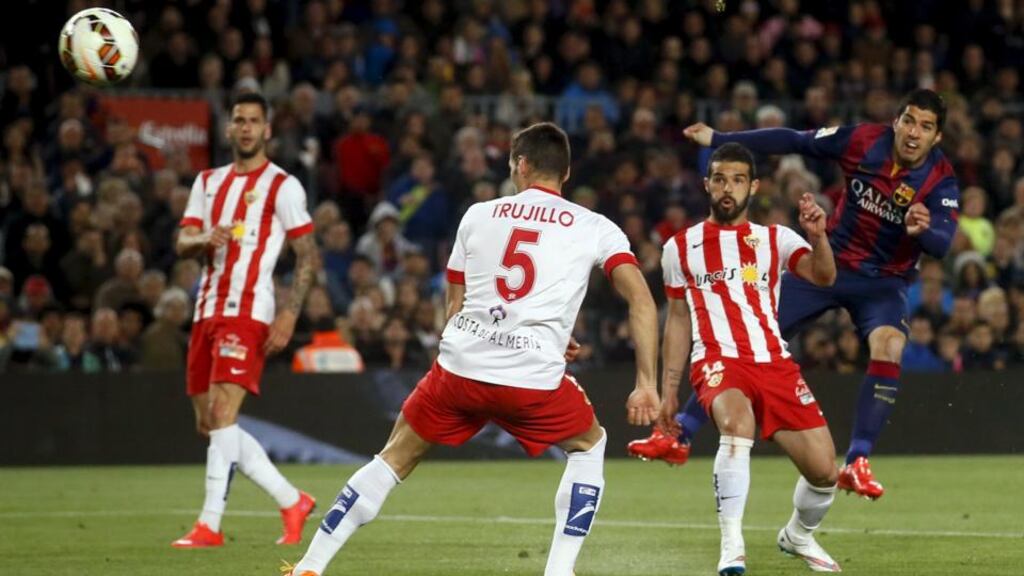 Barcelona’s Luis Suarez shoots to score a goal against Almeria during their Spanish first division soccer match at Nou Camp in Barcelona. Photograph: Albert Gea/Reuters