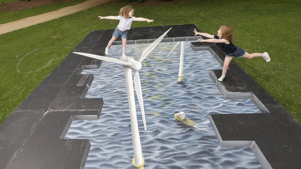 June (9) and Wren (6) from Coolock with a 3D artwork by artist Mark Cronin, at the announcement of the Fund. Photograph: Conor McCabe