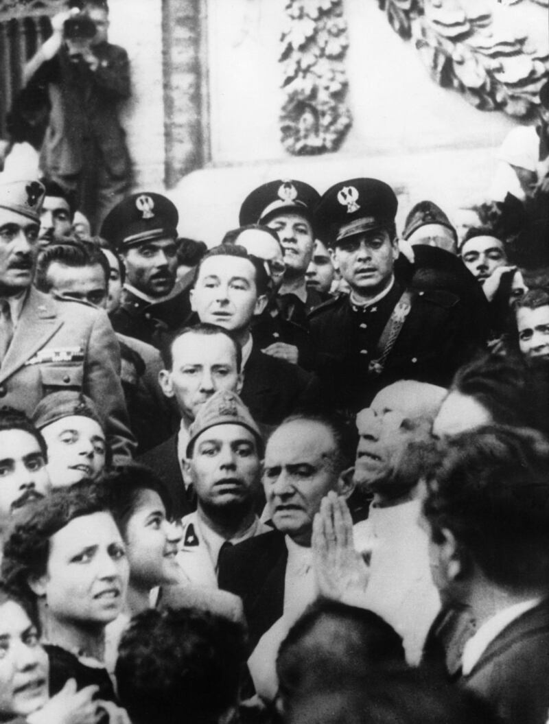 Following the Allied bombing on August 13th, 1943 of Rome, Pope Pius XII surrounded by Italian soldiers and policemen, prays for the end of the war. He visited the ruins caused by the bombing. During such public appearances through-out World War II, Pope PIUS XII always expressed his compassion for the victims of the conflict but never came out with a condemnation of Nazism. Photograph: Keystone-France/Gamma-Keystone/Getty