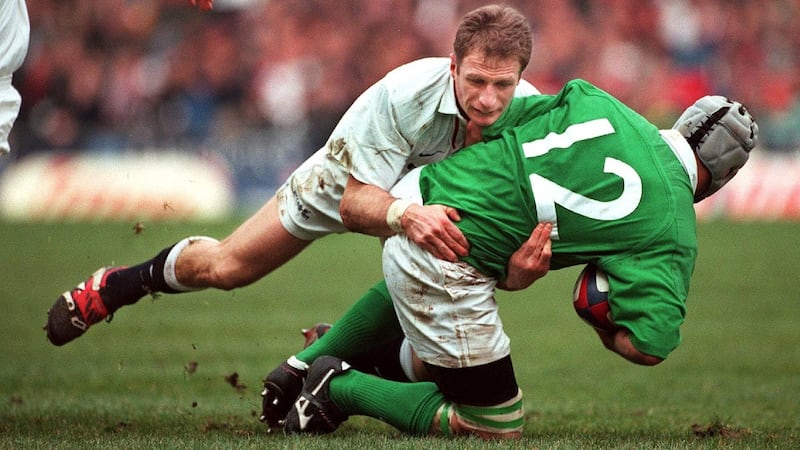 Mike Catt tackles Mike Mullins at Twickenham in 2000. Photograph: Eric Luke