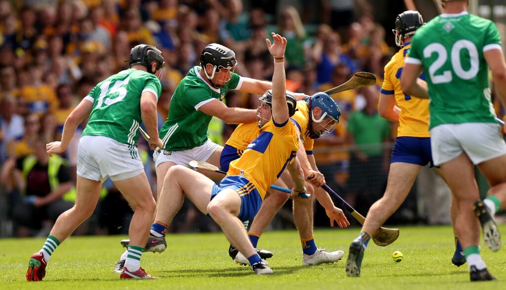 Limerick’s Peter Casey collides with Tony Kelly of Clare during the last play of the game. Photograph: James Crombie/Inpho
