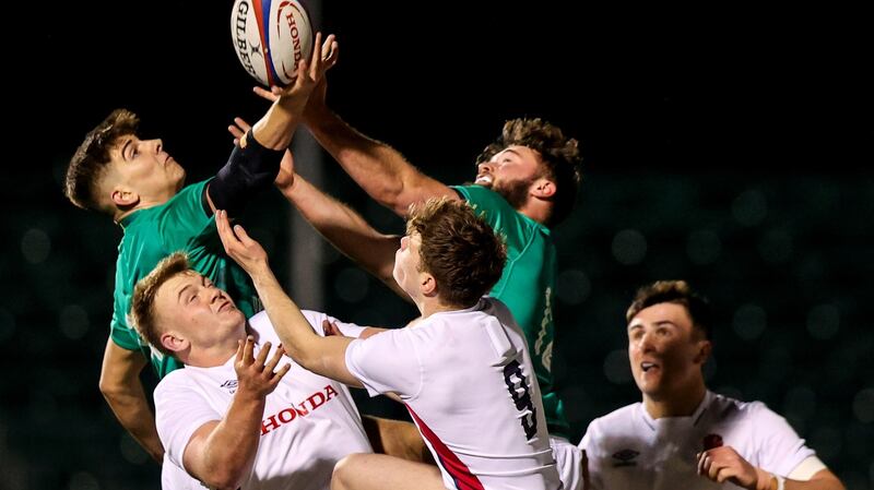 Ireland’s Chay Mullins and Ben Carson compete in the air with Toby Knight and Sam Edwards of England during the Under-20 Six Nations match at the  StoneX Stadium in  London. Photograph:  Ben Brady/Inpho