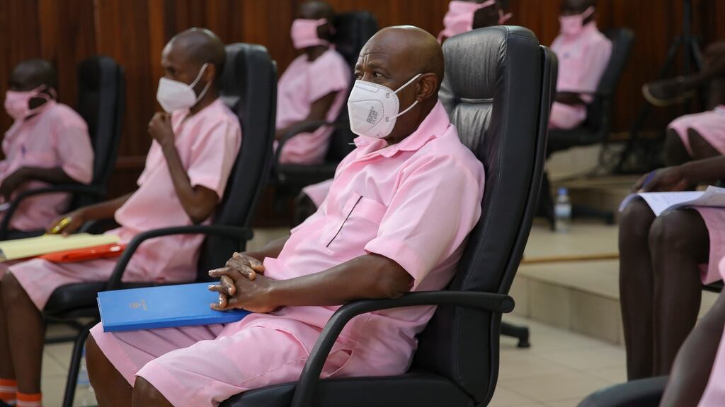 Paul Rusesabagina (centre) attends court with his coaccused at the start of his trial at the supreme court in Kigali, Rwanda  on Wednesday. Photograph: Eugene Uwimana/EPA