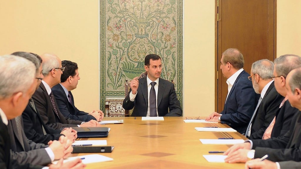 Syria's President Bashar al-Assad (c) meets members of a ministerial committee responsible for establishing a framework aimed at ending the two-year conflict with anti-government forces last week. Photograph: Reuters/Sana.