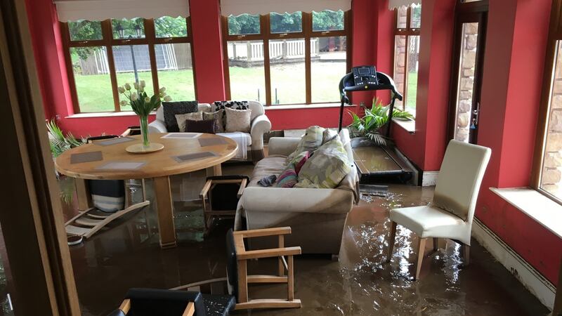 The dining room at Paul Bradley’s house, built on a flood plain of the Burnfoot river in Co Donegal, August 2017. Climate change is increasing the risks of flash flooding in summers months, as had occurred in Donegal recently, Dr Peter Stott of the UK Met Office told the Citizens’ Assembly. File photograph: Peter Murtagh/The Irish Times