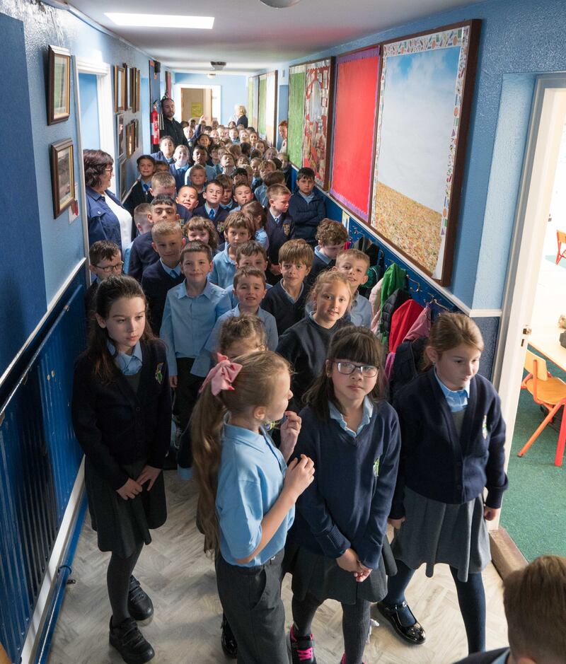Pupils at Campus 2, Scoil Mhuire, head out to playtime in the schoolyard supervised by Bernie McLoughlin, John Healy, Barbara Maye and Mary Scott. Photograph: Gerry Faughnan