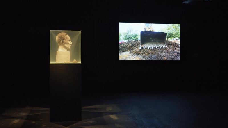 General view of exhibition including Cuban artist Lara Almarcegui’s video Buried House, Dallas