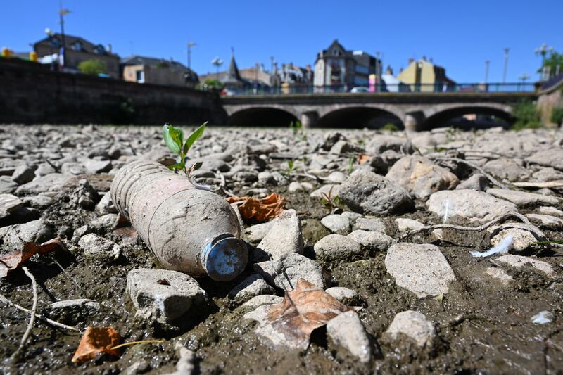 An empty plastic bottle on the dried-up La Savoureuse riverbed in Belfort, eastern France, in August. Photograph: Sebastien Bozon/Getty Images