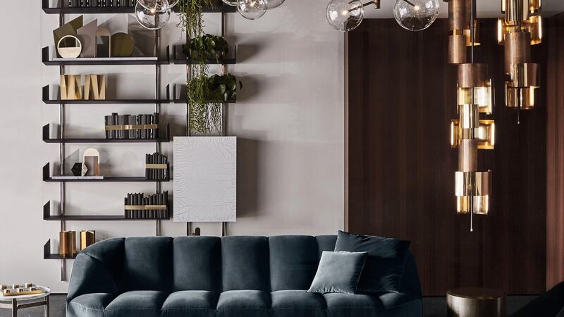 A Brera bookcase by Italian firm Gallotti & Radice is a shelving system hung onto satin nickel-plated brass vertical supports.