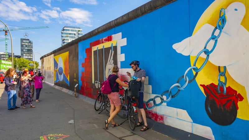 East Side Gallery - exhibiting the remaining of the Berlin Wall with street art covering the east side of the construction along the Spree river