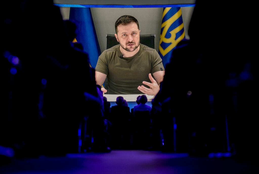 Volodymyr Zelensky is seen on screen as he addresses the audience from Kyiv during the World Economic Forum in Davos. Photograph: AP