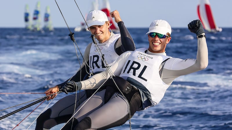 Ireland’s Robert Dickson and Seán Waddilove celebrate winning their final race at the 2020 Tokyo Olympic Games, in Enoshima Yacht Harbour, Fujisawa, Japan. Photograph: David Branigan/Oceansport/Inpho