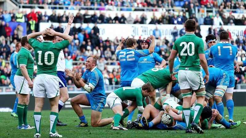 Ireland’s Paddy Jackson looks on dejected as Italy’s Sergio Parisse celebrates his side winning a late penalty during the loss in Rome in 2013. Photo: James Crombie/Inpho