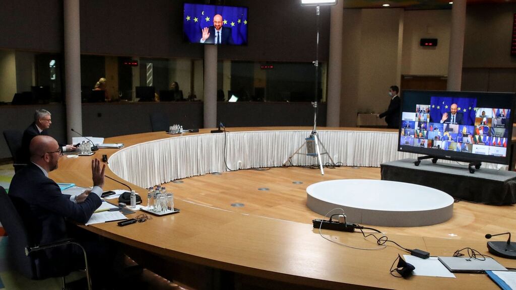 European Council president Charles Michel waves at the beginning of the summit at the European Council Building in Brussels. Photograph: Yves Herman/Pool/AFP via Getty Images