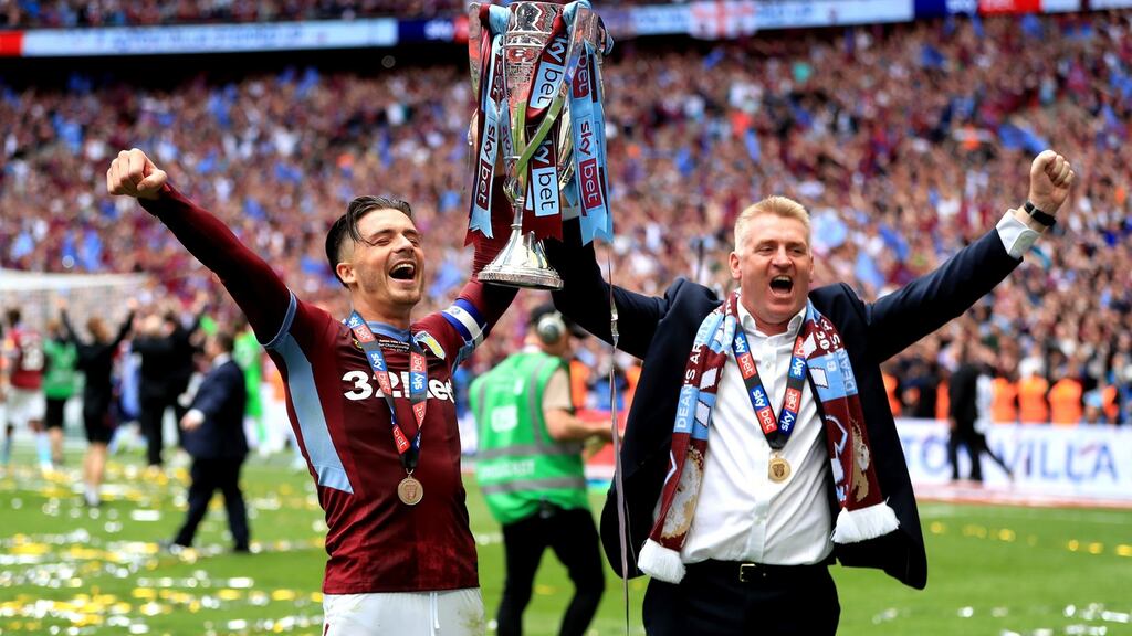 Jack Grealish and Dean Smith celebrate Aston Villa’s promotion to the Premier League. Photograph: Mike Egerton/PA
