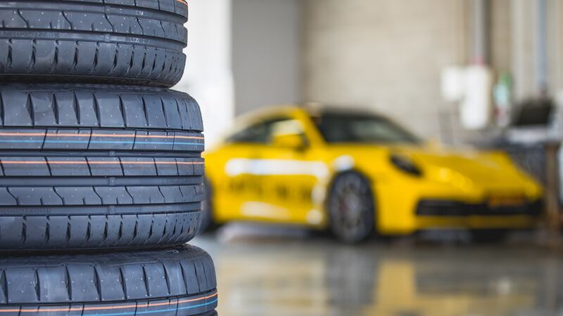 ‘I am at the Portimao track sitting behind the three-spoke steering wheel of a bright yellow Porsche 911 Carrera 4S testing tyres’
