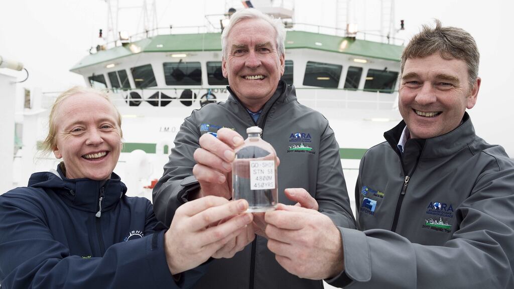 The Canadian Ambassador to Ireland, Kevin Vickers, is presented with a water sample from the deep ocean by Dr Caroline Cusack and  Dr Peter Heffernan of the Marine Institute.   Photograph: Andrew Downes