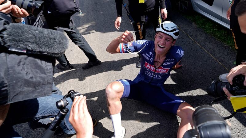 Mathieu van der Poel of the Netherlands celebrates after crossing the finish line at the end of the second stage of the Tour de France between Perros-Guirrec and Mur de Bretagne Guerledan. Photograph: Daniel Cole/AFP via Getty Images