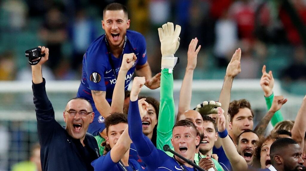 Chelsea’s Eden Hazard and his team-mates celebrate with manager Maurizio Sarri after winning the Europa League in Baku. Photographs: Maxim Shemetov/Reuters