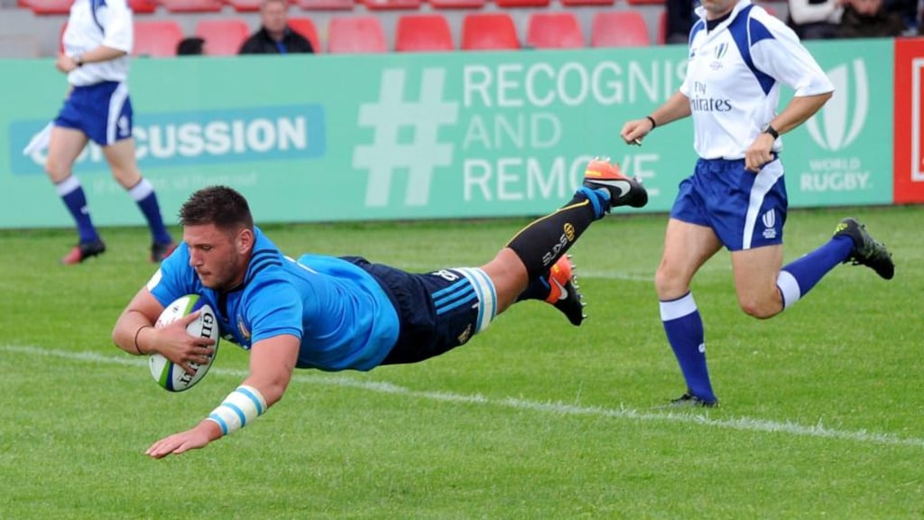 Italy’s Jacopo Bianchi scores a try. Photograph: Achi Gegenavai/Inpho