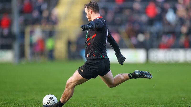 Mayo’s Rob Hennelly kicks a point to earn his side a late draw with Donegal. Photograph: James Crombie/Inpho