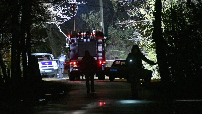 Investigators and experts work at the site where Amina Okuyeva was shot dead in the small town of Hlevakha, some 30km south of Kiev. Photograph: Genya Savilov/AFP/Getty Images