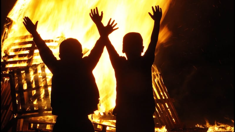 Children in front of an unsupervised Halloween bonfire  in Dublin. Photograph: Brenda Fitzsimons